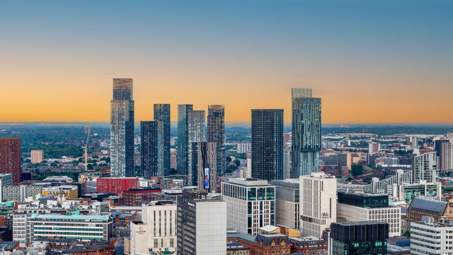Manchester city centre towers at sunset