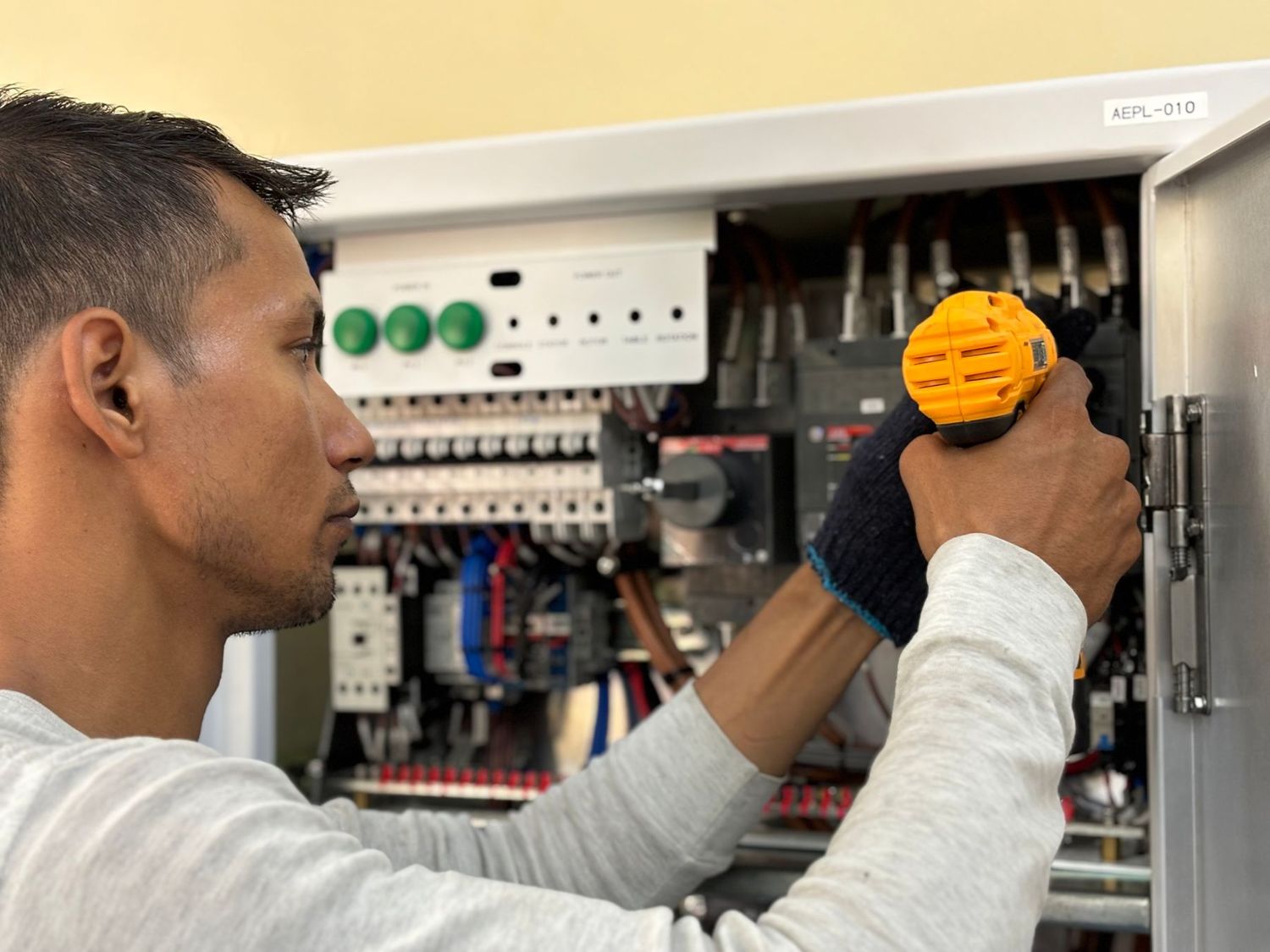 An electrician checking a distribution board